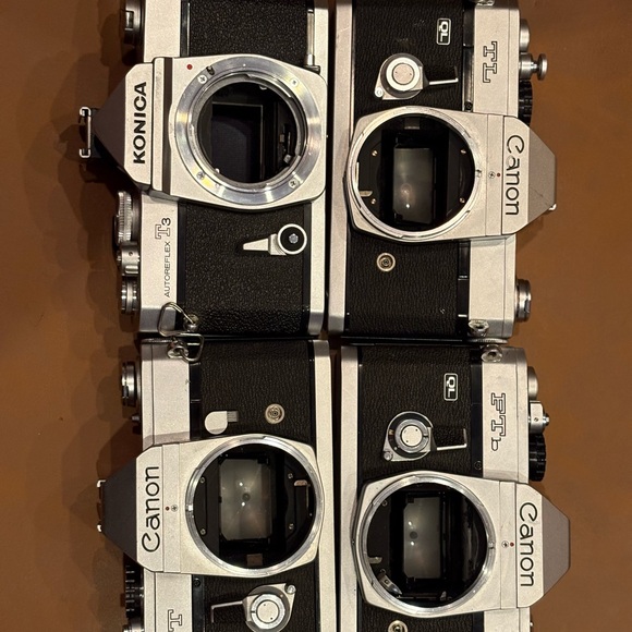 Canon and Konica Black and Silver Film Cameras